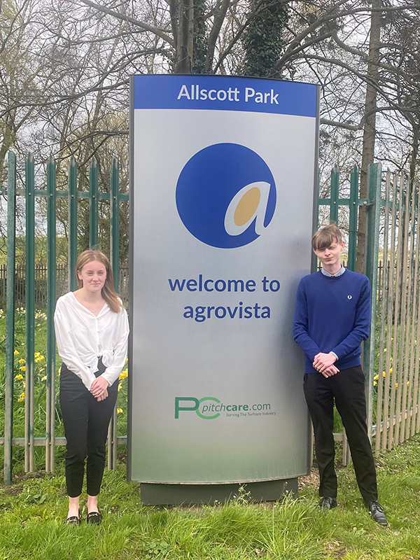 two new apprentices standing outside the entrance to Allscott depot